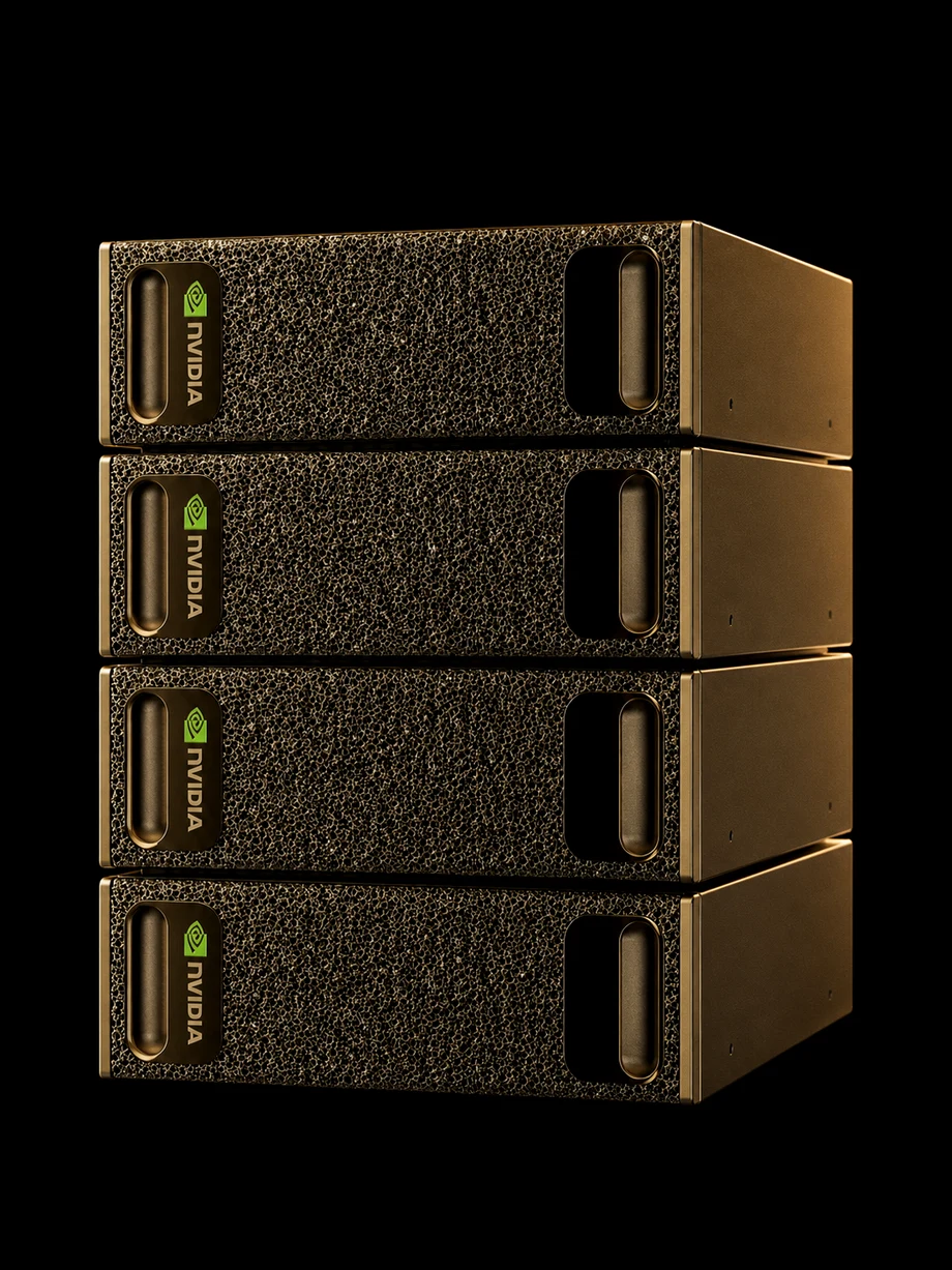 Four NVIDIA DGX Spark units stacked two by two under warm amber studio light